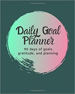 90 day goal planner cover with teal background and paint circled with lighter teal and pink