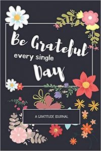 cover of journal image - be grateful for every single day - a gratitude journal with multicolor flowers on a dark background